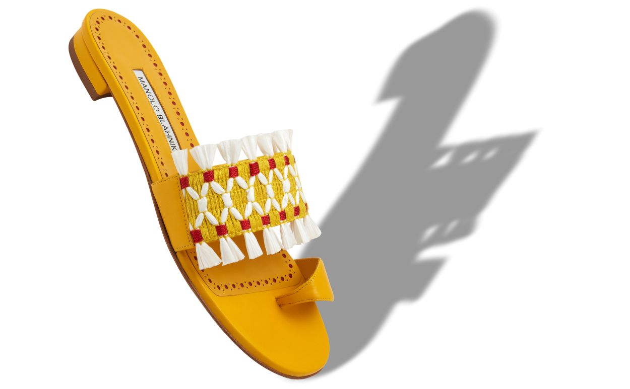 Mules plates en cuir de nappa jaune avec détail en raphia