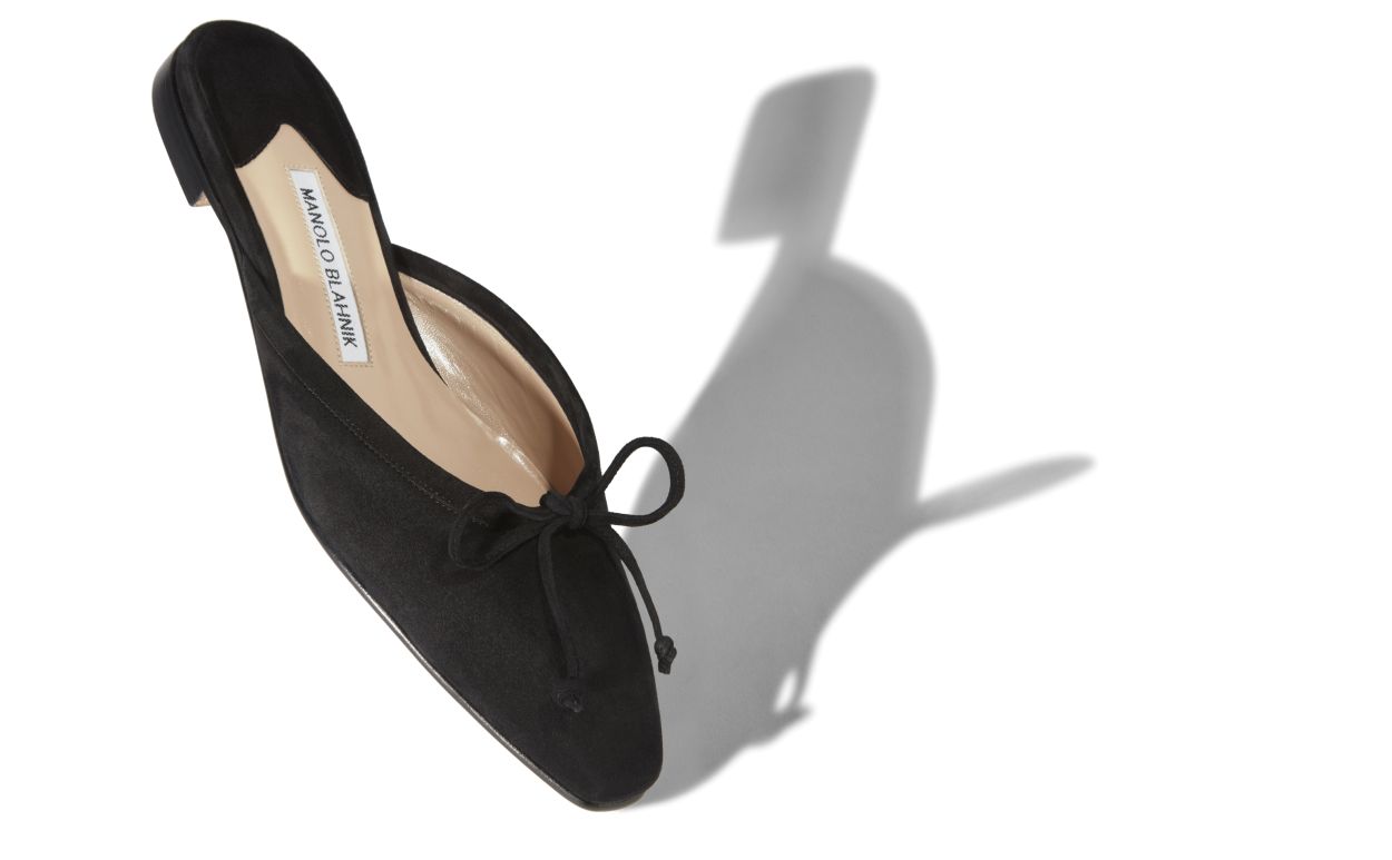 Mules plates en daim noir